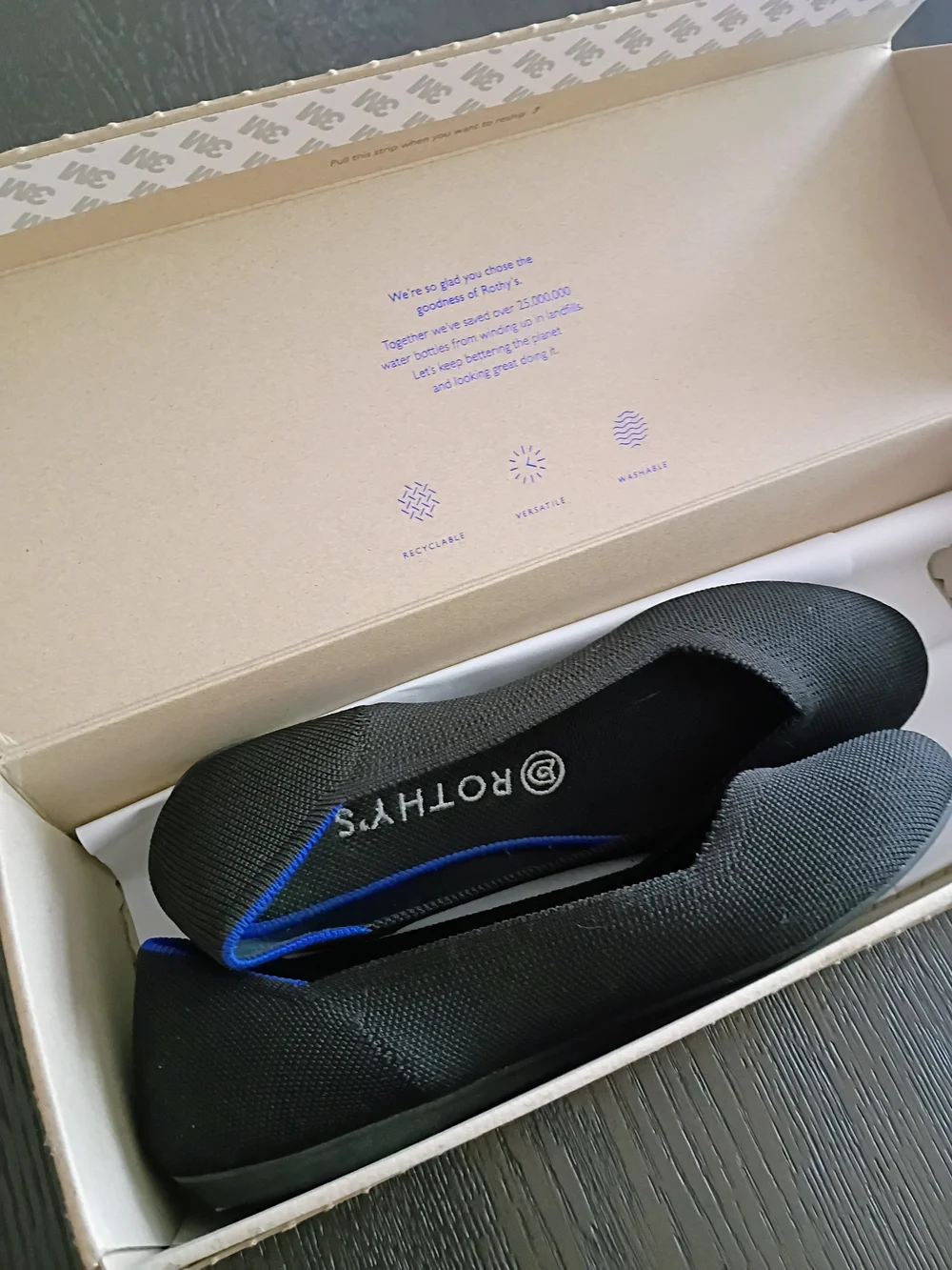 Rothy's Women's Black Slip-On Flats with Blue Trim